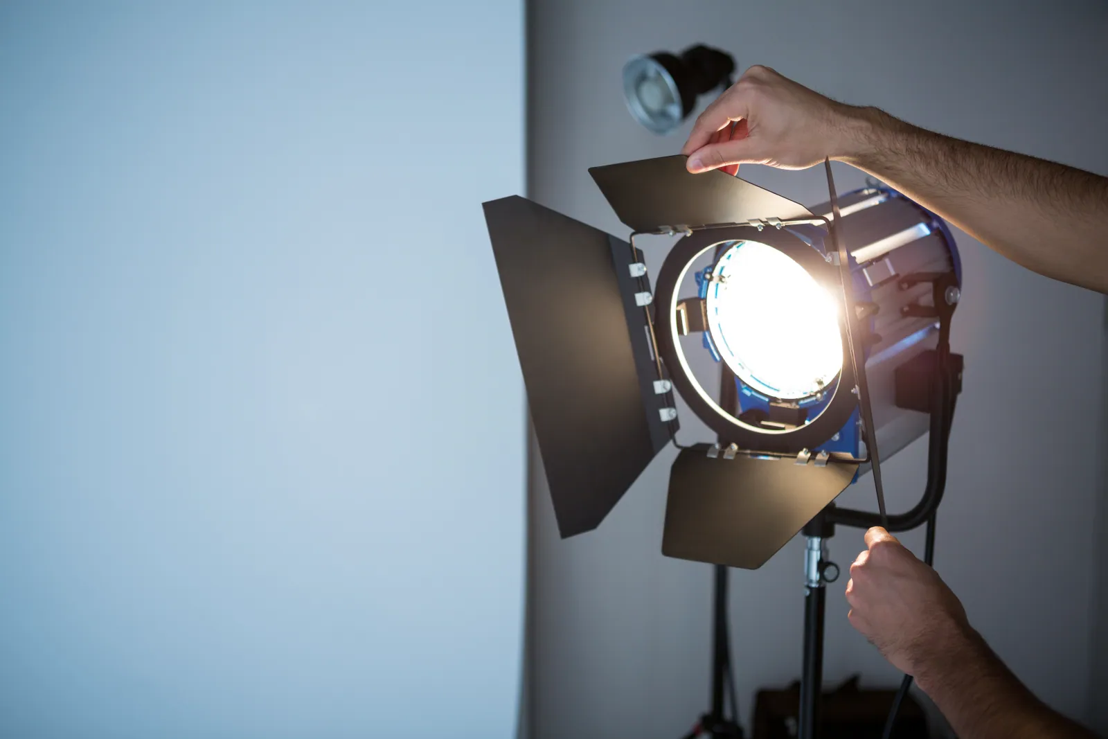 photographer-adjusting-spotlight-2023-11-27-05-18-21-utc